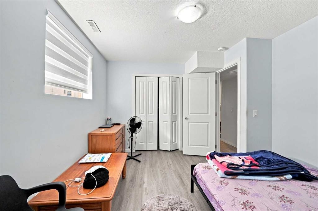 201 Saddlelake Drive Ne, Calgary, AB - Indoor Photo Showing Bedroom