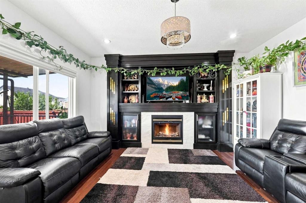 201 Saddlelake Drive Ne, Calgary, AB - Indoor Photo Showing Living Room With Fireplace