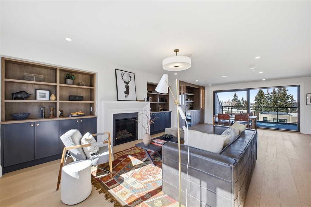 2023 27 Avenue Sw, Calgary, AB - Indoor Photo Showing Living Room With Fireplace