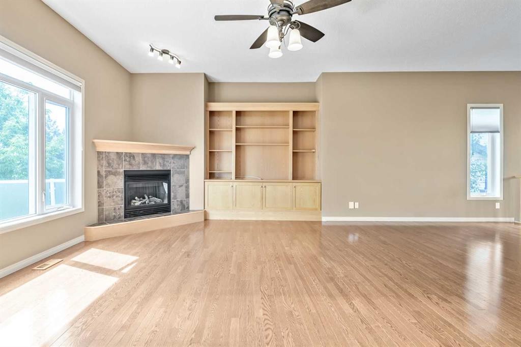 315 Willow Ridge Way, Diamond Valley, AB - Indoor Photo Showing Living Room With Fireplace