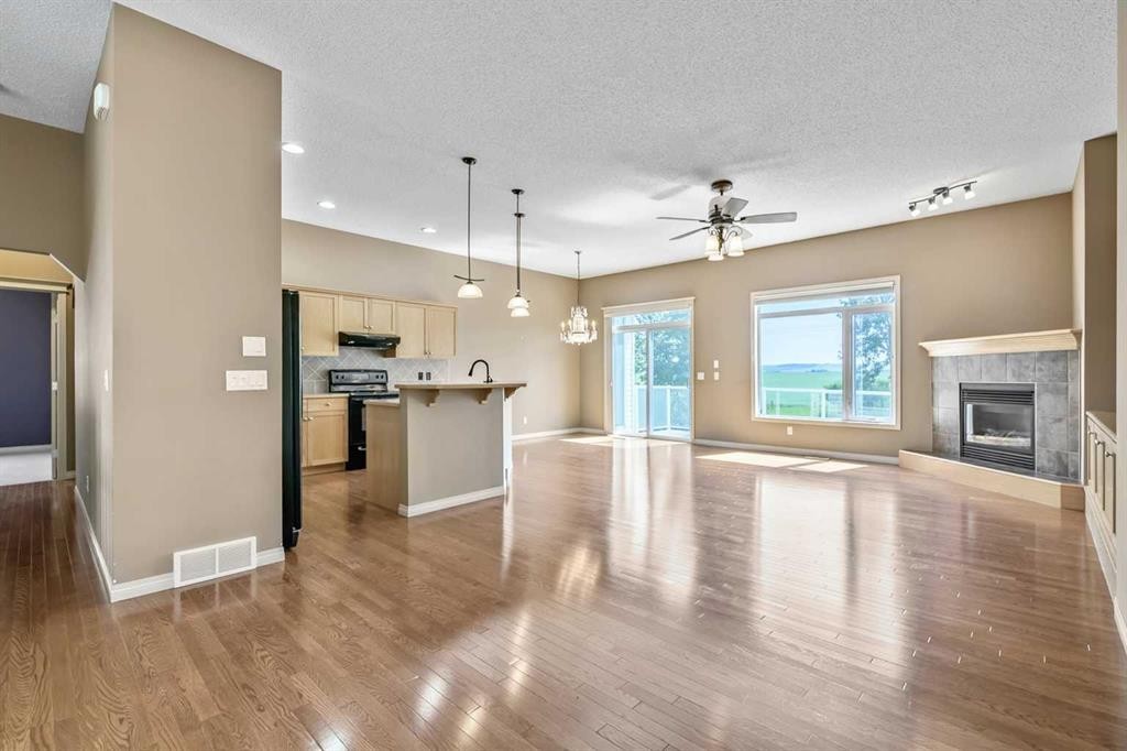 315 Willow Ridge Way, Diamond Valley, AB - Indoor With Fireplace