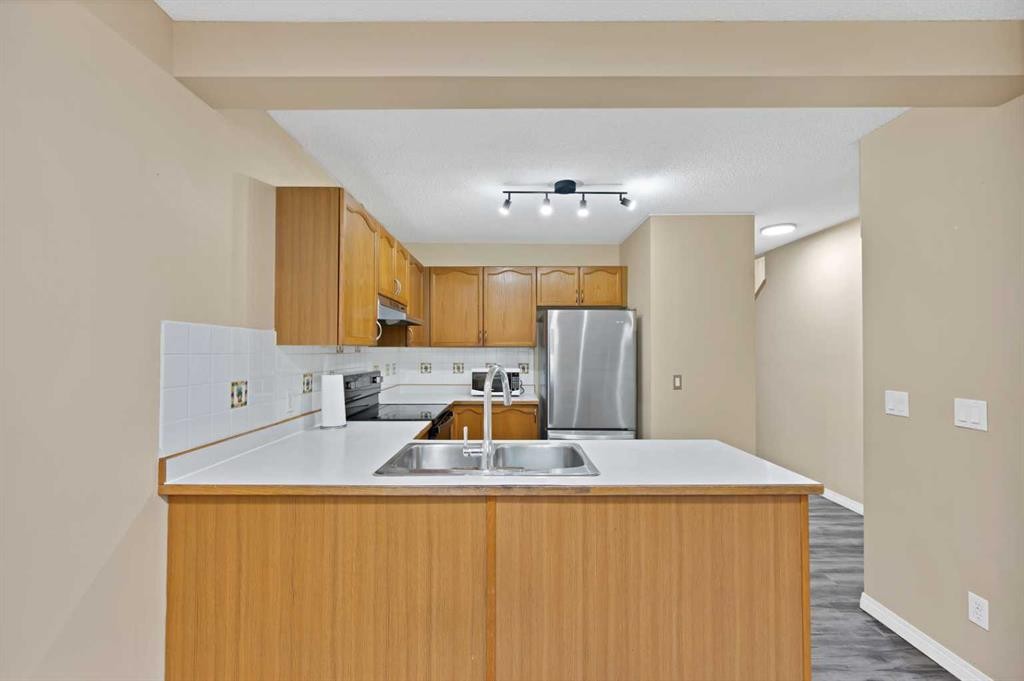 54 Martinridge Road Ne, Calgary, AB - Indoor Photo Showing Kitchen With Double Sink