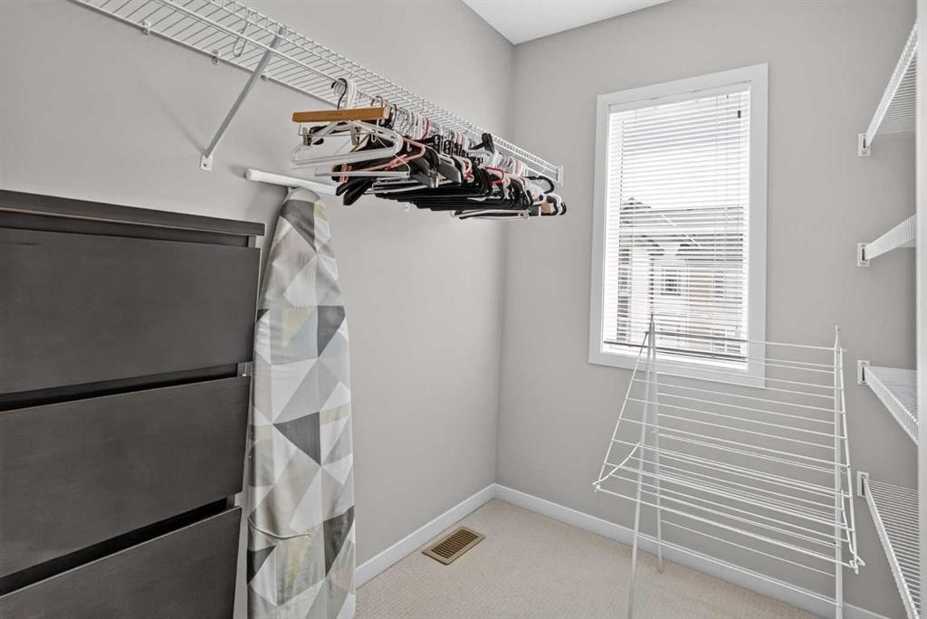 202 Copperpond Row Se, Calgary, AB - Indoor With Storage
