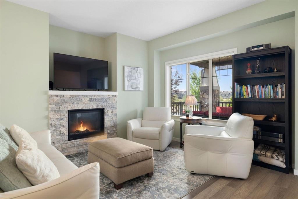 719 Mahogany Boulevard Se, Calgary, AB - Indoor Photo Showing Living Room With Fireplace
