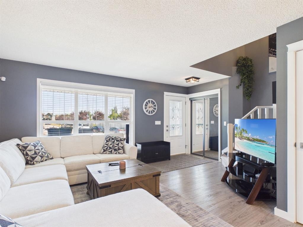 2049 New Brighton Gardens Se, Calgary, AB - Indoor Photo Showing Living Room