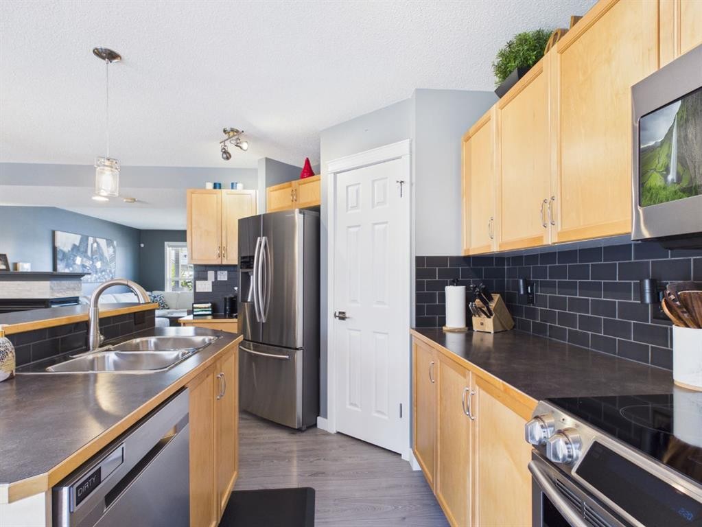 2049 New Brighton Gardens Se, Calgary, AB - Indoor Photo Showing Kitchen With Double Sink