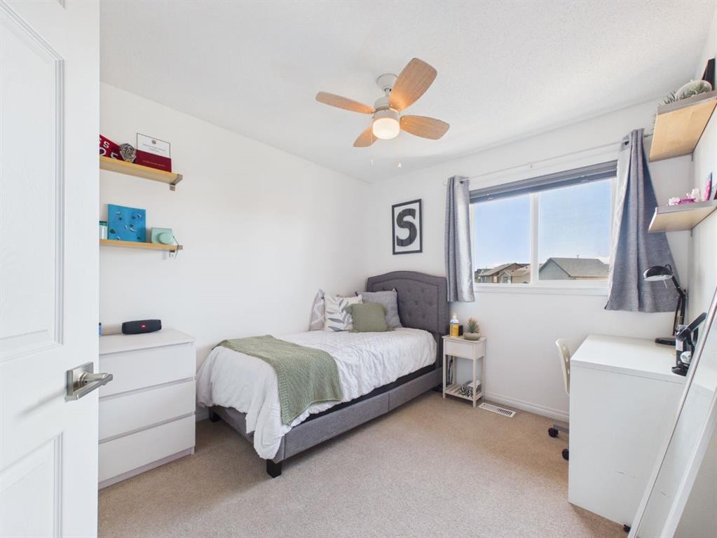 2049 New Brighton Gardens Se, Calgary, AB - Indoor Photo Showing Bedroom