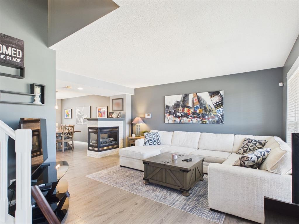 2049 New Brighton Gardens Se, Calgary, AB - Indoor Photo Showing Living Room With Fireplace