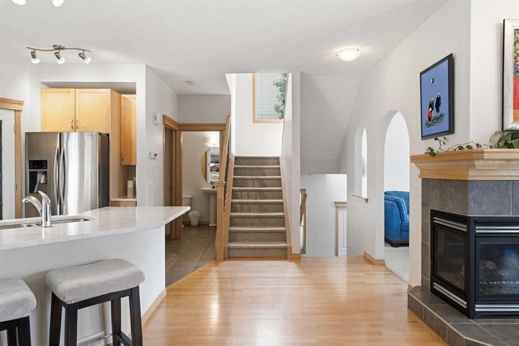 54 Rockyledge Rise Nw, Calgary, AB - Indoor With Fireplace