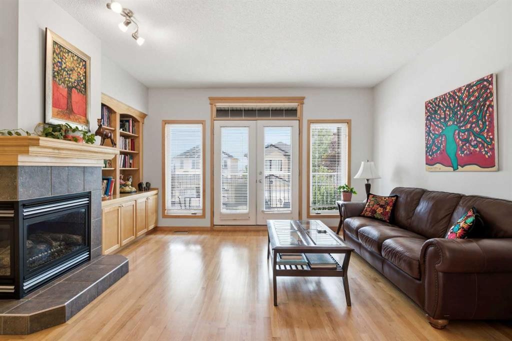 54 Rockyledge Rise Nw, Calgary, AB - Indoor Photo Showing Living Room With Fireplace