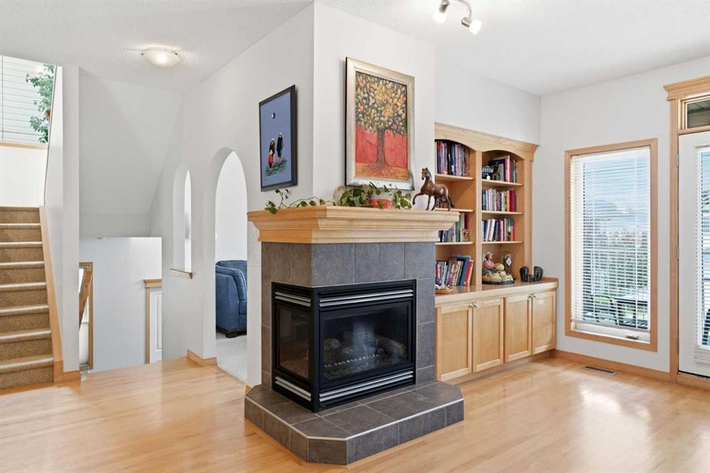 54 Rockyledge Rise Nw, Calgary, AB - Indoor Photo Showing Living Room With Fireplace