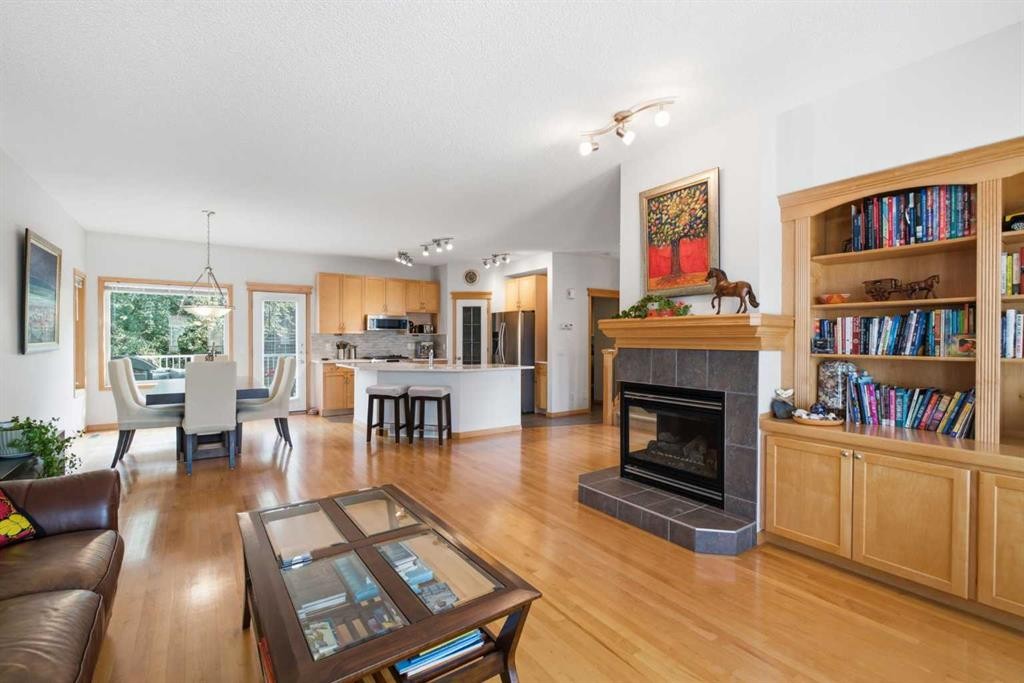54 Rockyledge Rise Nw, Calgary, AB - Indoor Photo Showing Living Room With Fireplace