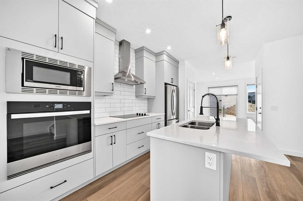125 Herron Mews Ne, Calgary, AB - Indoor Photo Showing Kitchen With Double Sink With Upgraded Kitchen