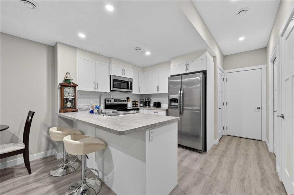 97 Seton Manor Se, Calgary, AB - Indoor Photo Showing Kitchen With Double Sink
