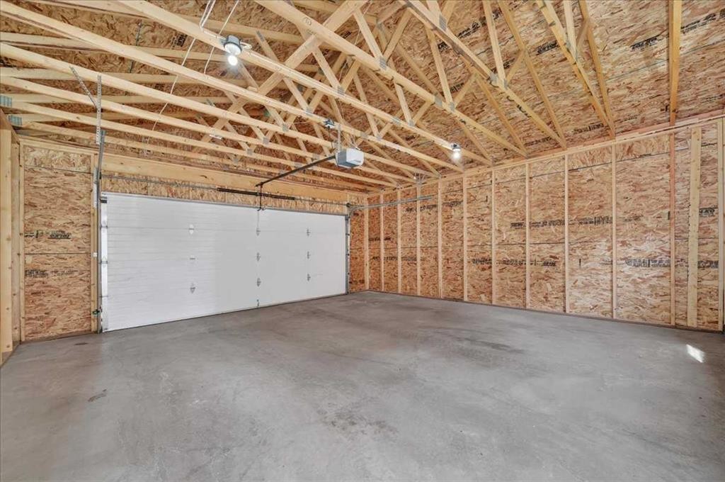 97 Seton Manor Se, Calgary, AB - Indoor Photo Showing Garage