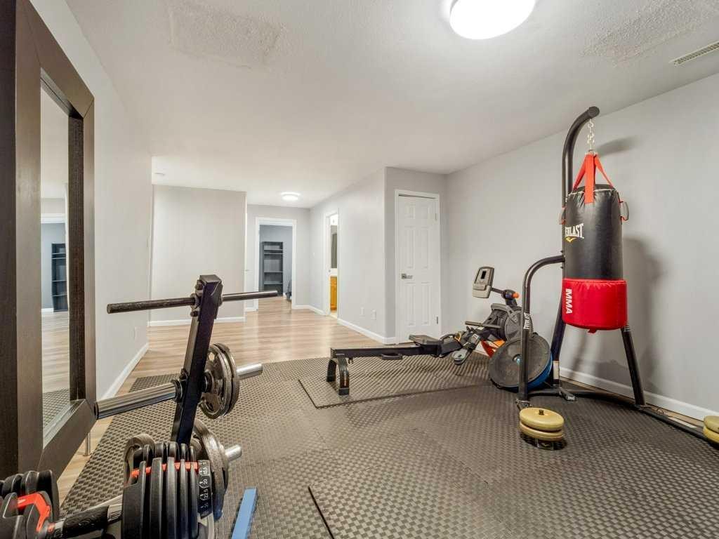 338 Deer Run Place West, Rural Lethbridge County, AB - Indoor Photo Showing Gym Room