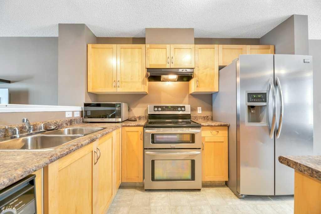 80 Elgin Gardens Se, Calgary, AB - Indoor Photo Showing Kitchen With Double Sink