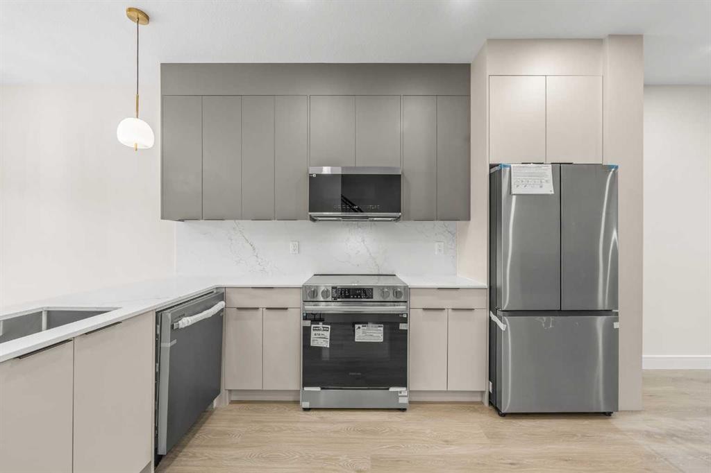 301-67 Panatella Square Nw, Calgary, AB - Indoor Photo Showing Kitchen With Stainless Steel Kitchen With Upgraded Kitchen