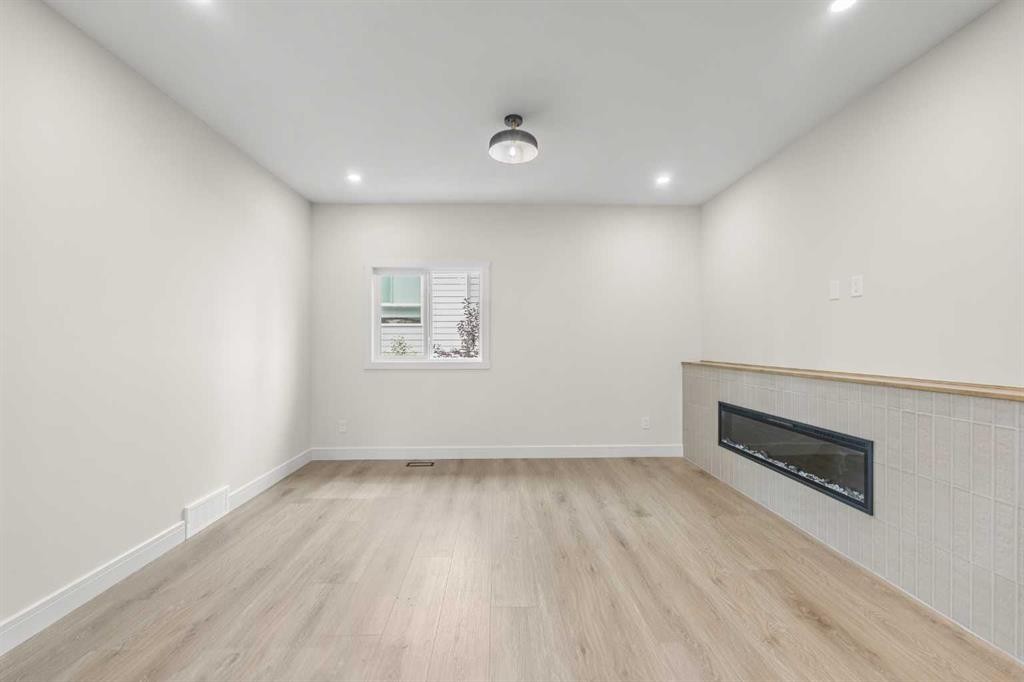 301-67 Panatella Square Nw, Calgary, AB - Indoor With Fireplace