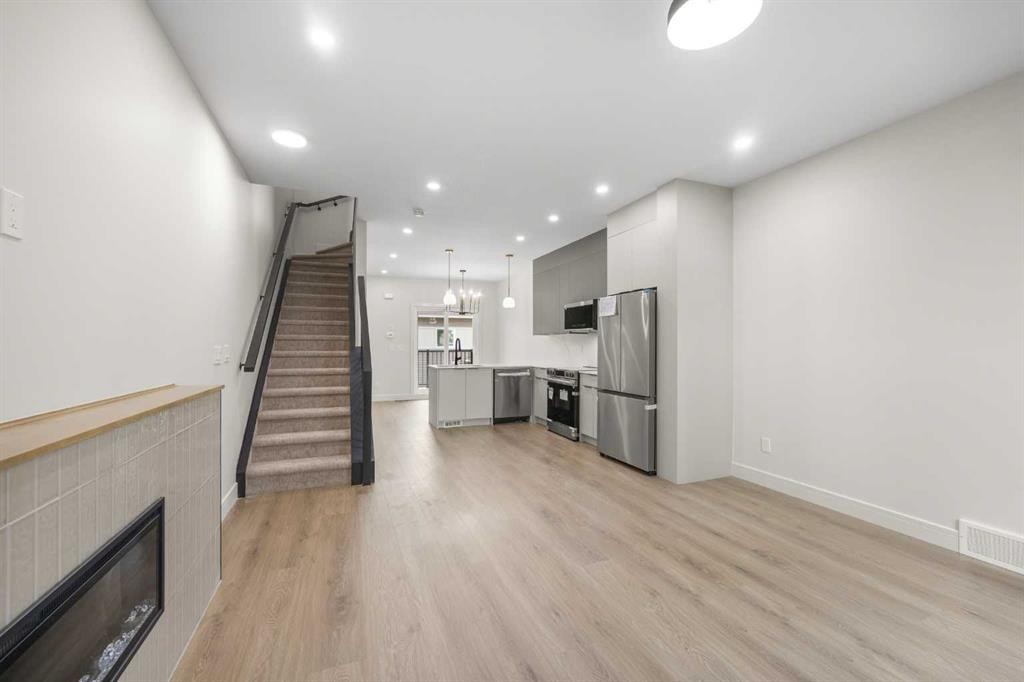301-67 Panatella Square Nw, Calgary, AB - Indoor With Fireplace