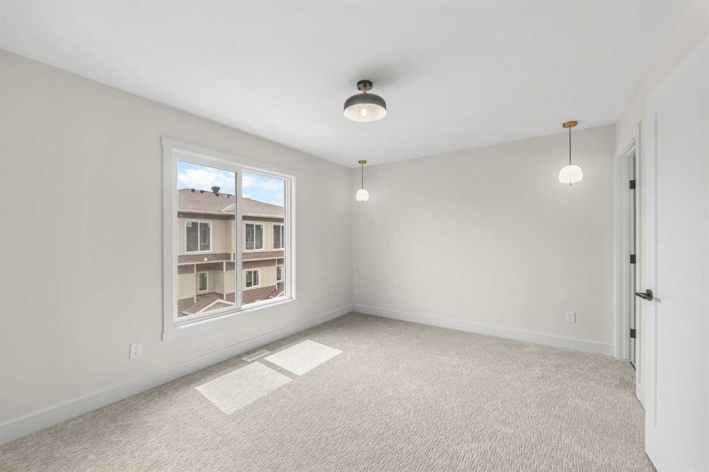 301-67 Panatella Square Nw, Calgary, AB - Indoor Photo Showing Other Room