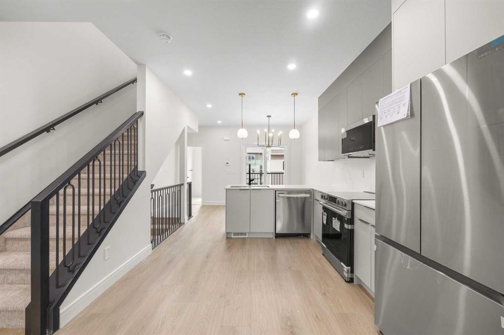 301-67 Panatella Square Nw, Calgary, AB - Indoor Photo Showing Kitchen With Stainless Steel Kitchen With Upgraded Kitchen