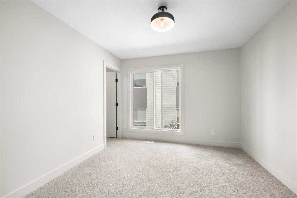 301-67 Panatella Square Nw, Calgary, AB - Indoor Photo Showing Other Room