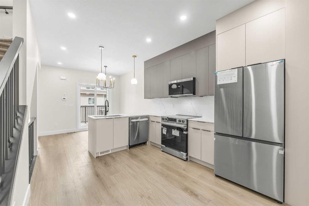 301-67 Panatella Square Nw, Calgary, AB - Indoor Photo Showing Kitchen With Stainless Steel Kitchen With Upgraded Kitchen
