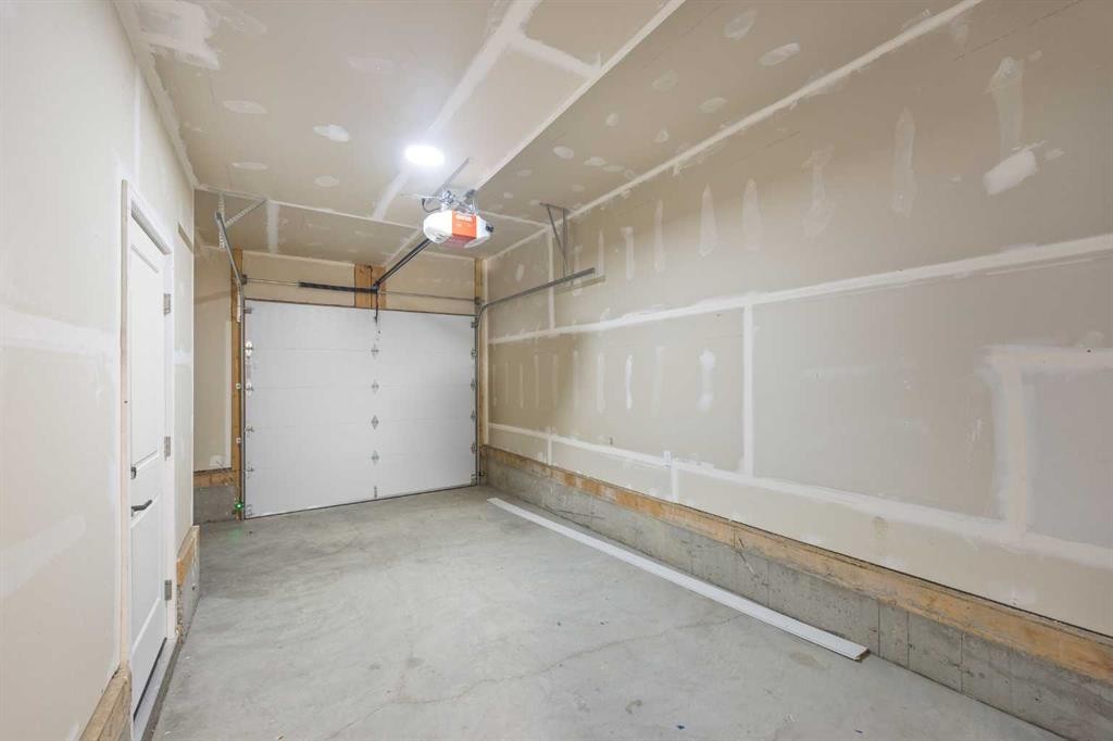 301-67 Panatella Square Nw, Calgary, AB - Indoor Photo Showing Garage