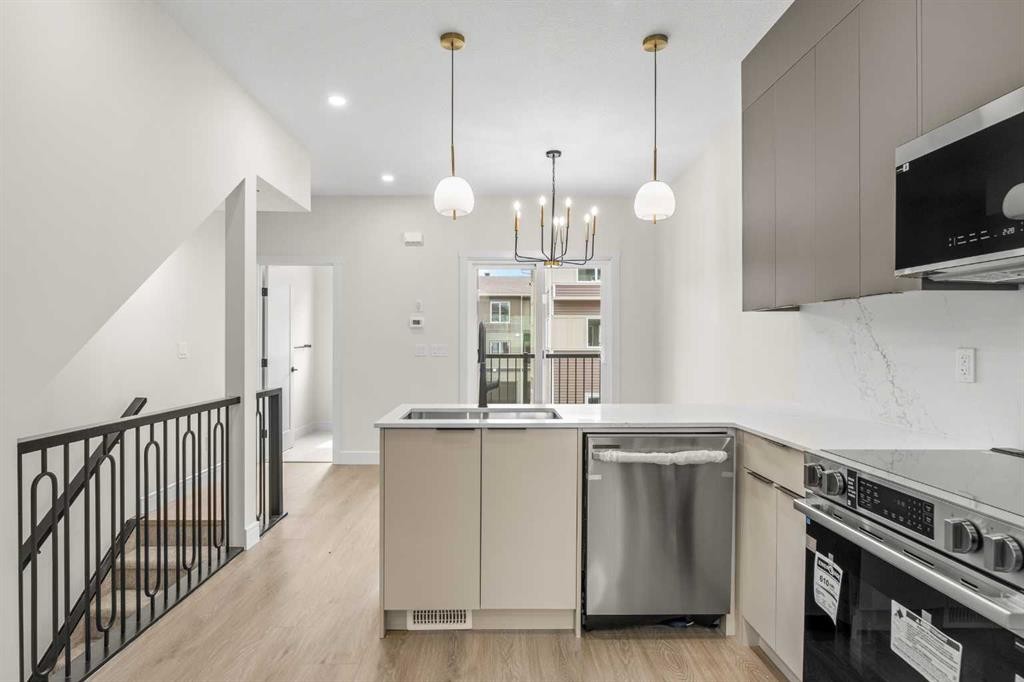 301-67 Panatella Square Nw, Calgary, AB - Indoor Photo Showing Kitchen With Stainless Steel Kitchen With Upgraded Kitchen