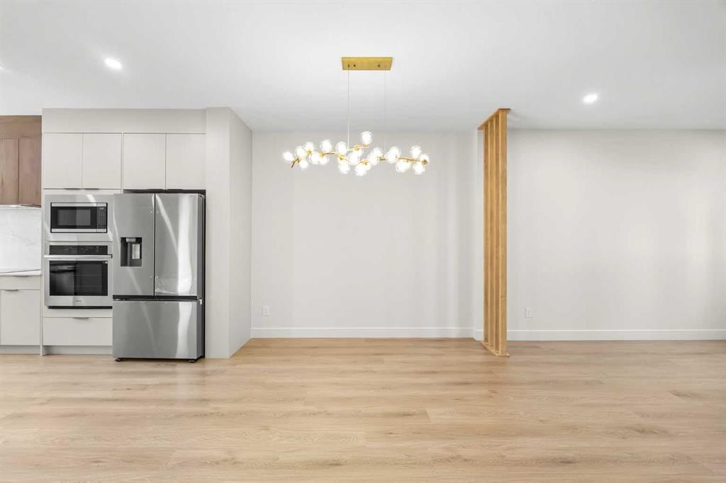302-67 Panatella Square Nw, Calgary, AB - Indoor Photo Showing Kitchen With Stainless Steel Kitchen