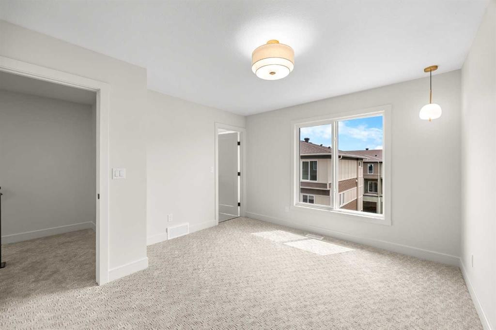 302-67 Panatella Square Nw, Calgary, AB - Indoor Photo Showing Other Room
