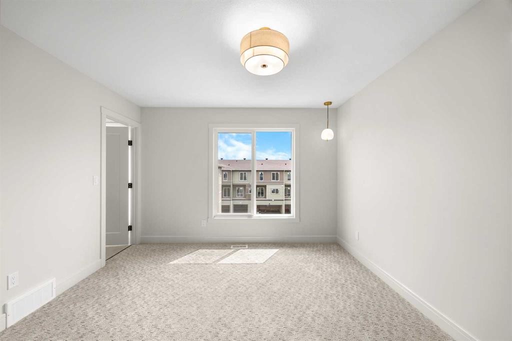 302-67 Panatella Square Nw, Calgary, AB - Indoor Photo Showing Other Room