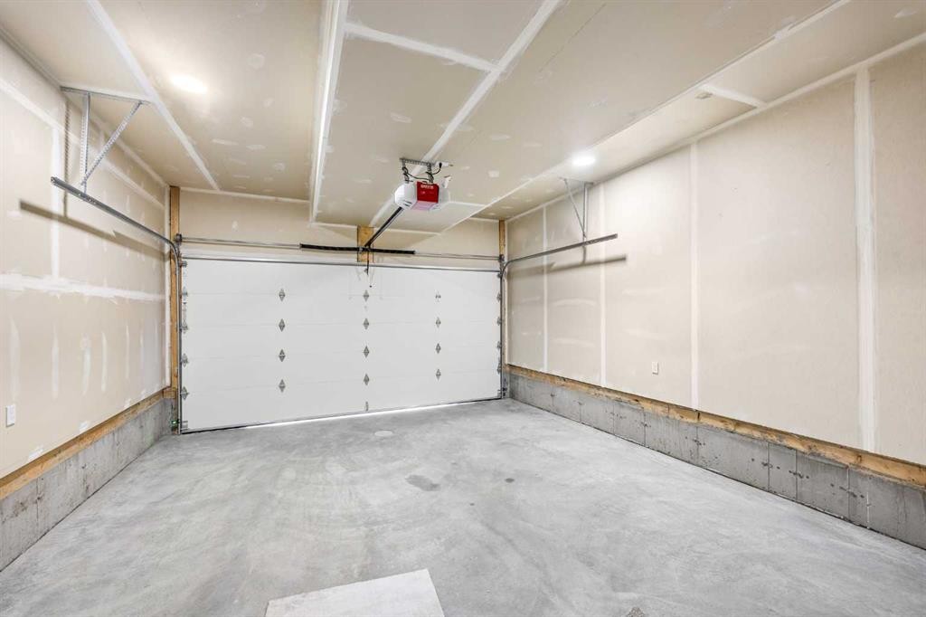 302-67 Panatella Square Nw, Calgary, AB - Indoor Photo Showing Garage