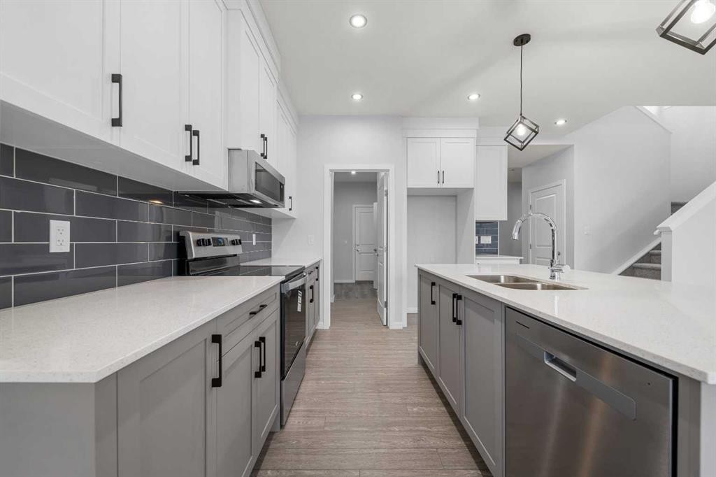 532 Clearwater Heath, Chestermere, AB - Indoor Photo Showing Kitchen With Double Sink With Upgraded Kitchen