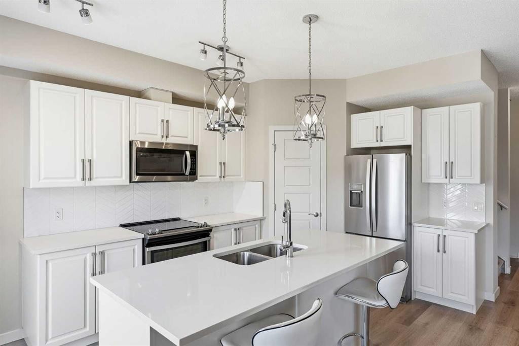 308-32 Red Embers Parade Ne, Calgary, AB - Indoor Photo Showing Kitchen With Stainless Steel Kitchen With Double Sink With Upgraded Kitchen
