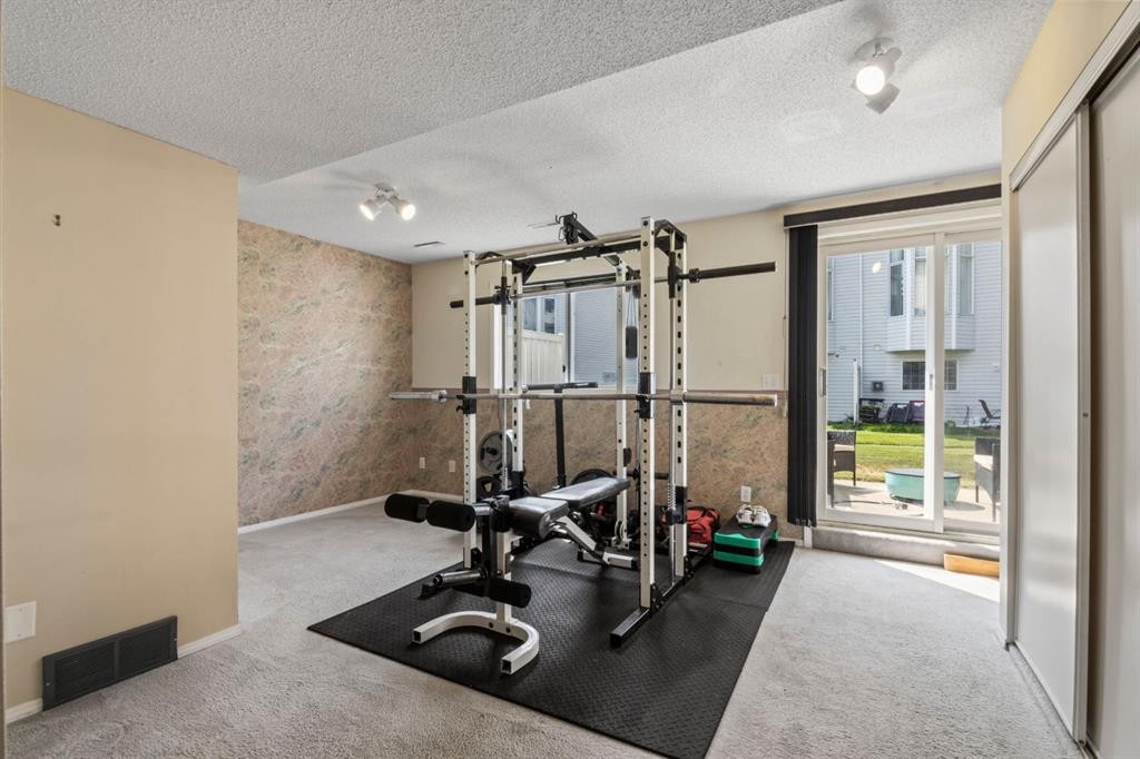 623 Hawkstone Manor Nw, Calgary, AB - Indoor Photo Showing Gym Room
