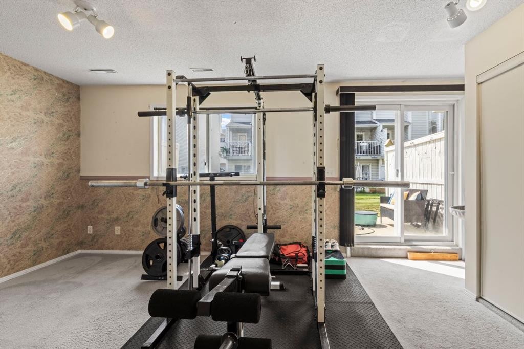623 Hawkstone Manor Nw, Calgary, AB - Indoor Photo Showing Gym Room