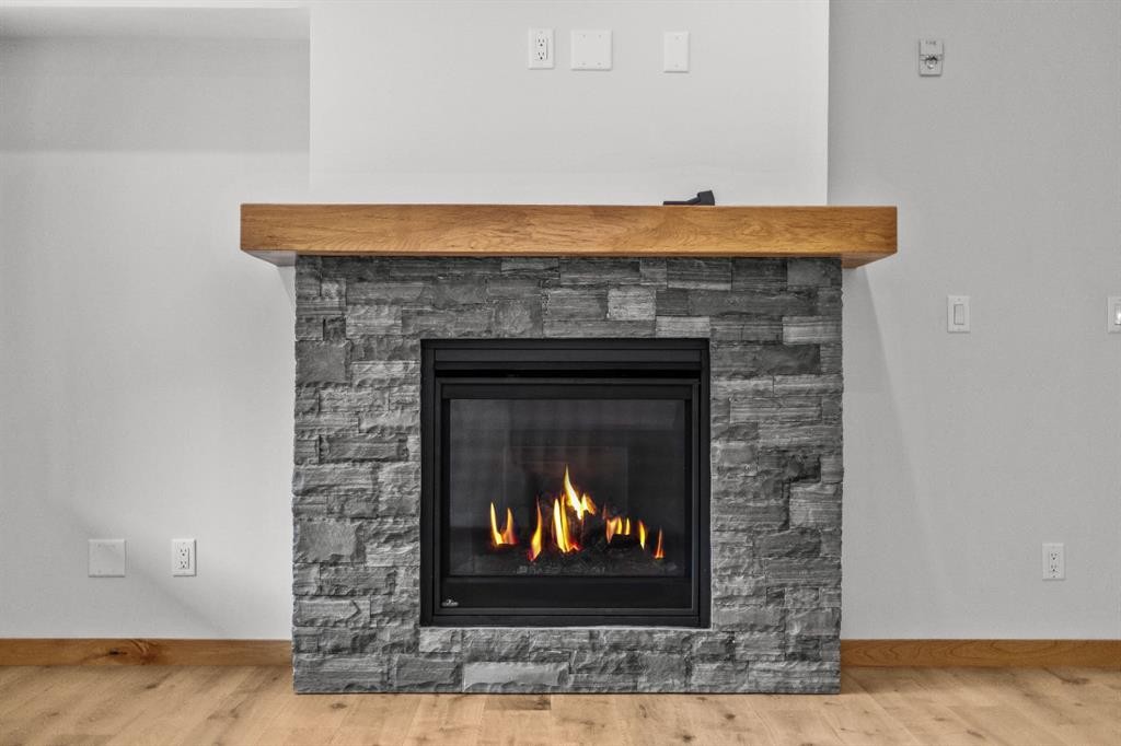 108-1606 Spring Creek Gate, Canmore, AB - Indoor Photo Showing Living Room With Fireplace