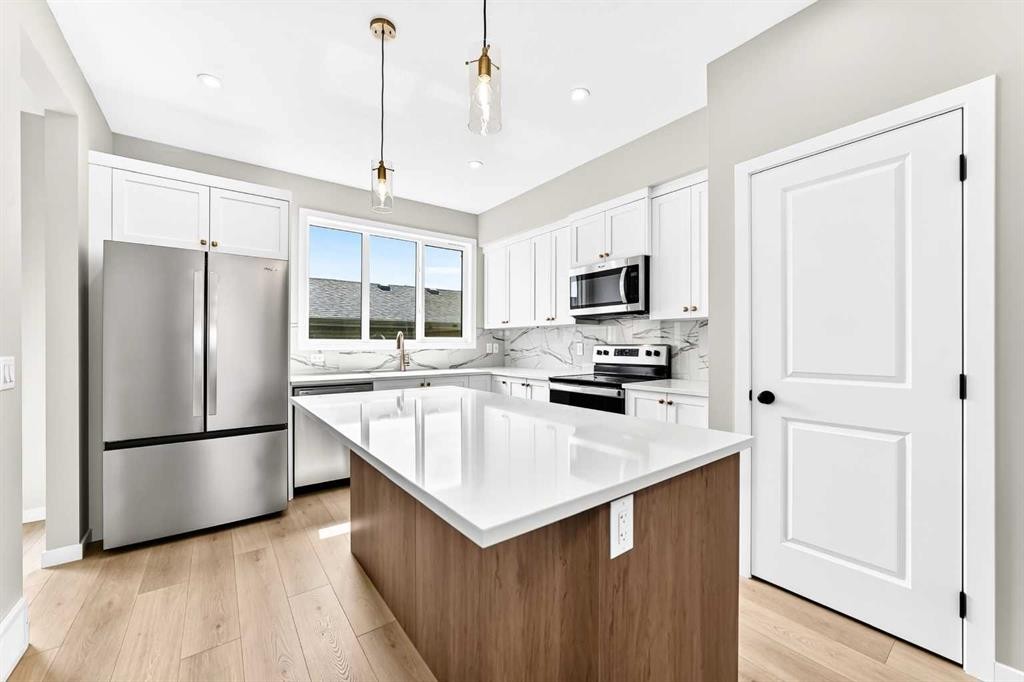 277 Heirloom Way Se, Calgary, AB - Indoor Photo Showing Kitchen With Upgraded Kitchen