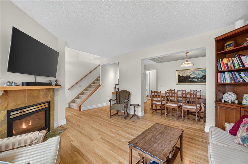2511 Exshaw Road Nw, Calgary, AB - Indoor Photo Showing Living Room With Fireplace