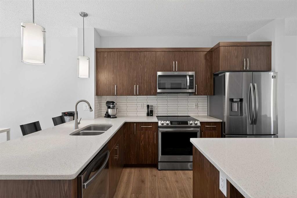 226 148 Avenue Nw, Calgary, AB - Indoor Photo Showing Kitchen With Stainless Steel Kitchen With Double Sink With Upgraded Kitchen