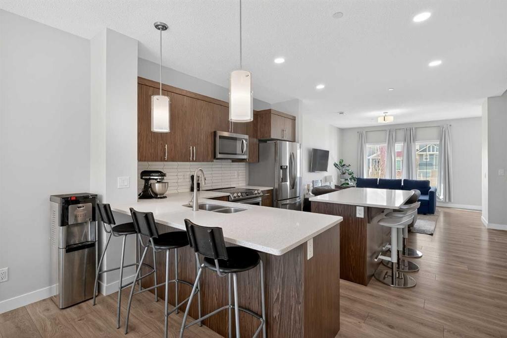 226 148 Avenue Nw, Calgary, AB - Indoor Photo Showing Kitchen With Stainless Steel Kitchen With Double Sink With Upgraded Kitchen