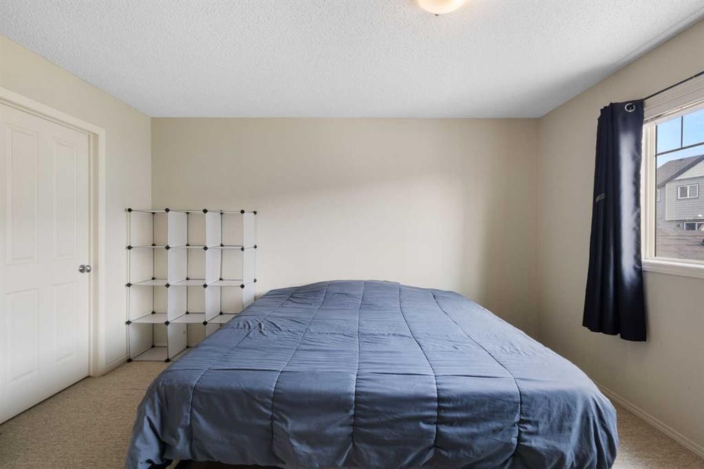 17 Panatella Villas Nw, Calgary, AB - Indoor Photo Showing Bedroom