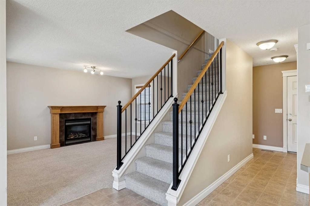 184 Cimarron Park Circle, Okotoks, AB - Indoor With Fireplace