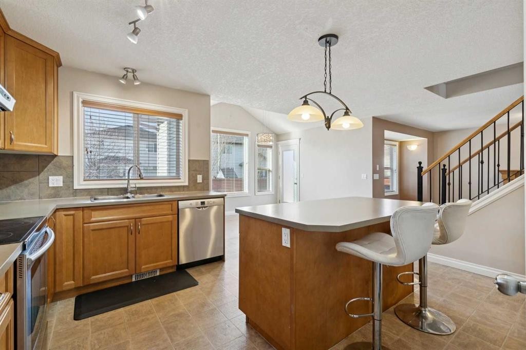 184 Cimarron Park Circle, Okotoks, AB - Indoor Photo Showing Kitchen With Double Sink