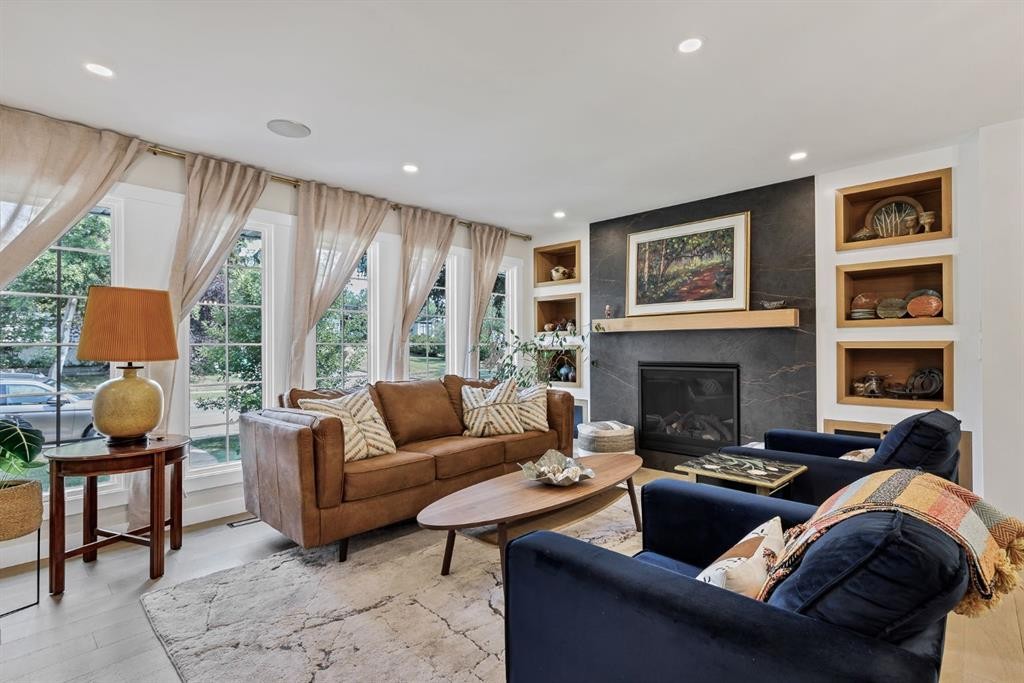 179 Capri Avenue Nw, Calgary, AB - Indoor Photo Showing Living Room With Fireplace