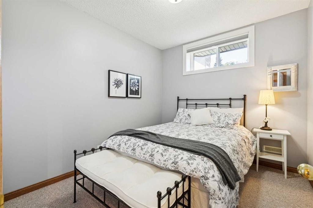 22 Patrick View Sw, Calgary, AB - Indoor Photo Showing Bedroom