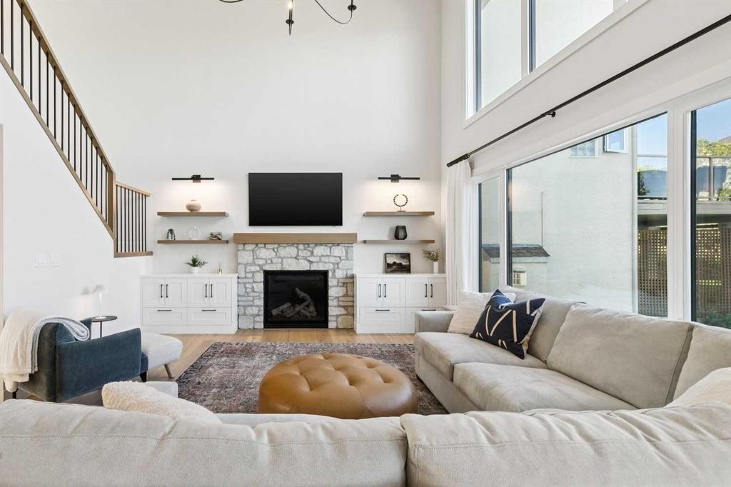22 Patrick View Sw, Calgary, AB - Indoor Photo Showing Living Room With Fireplace