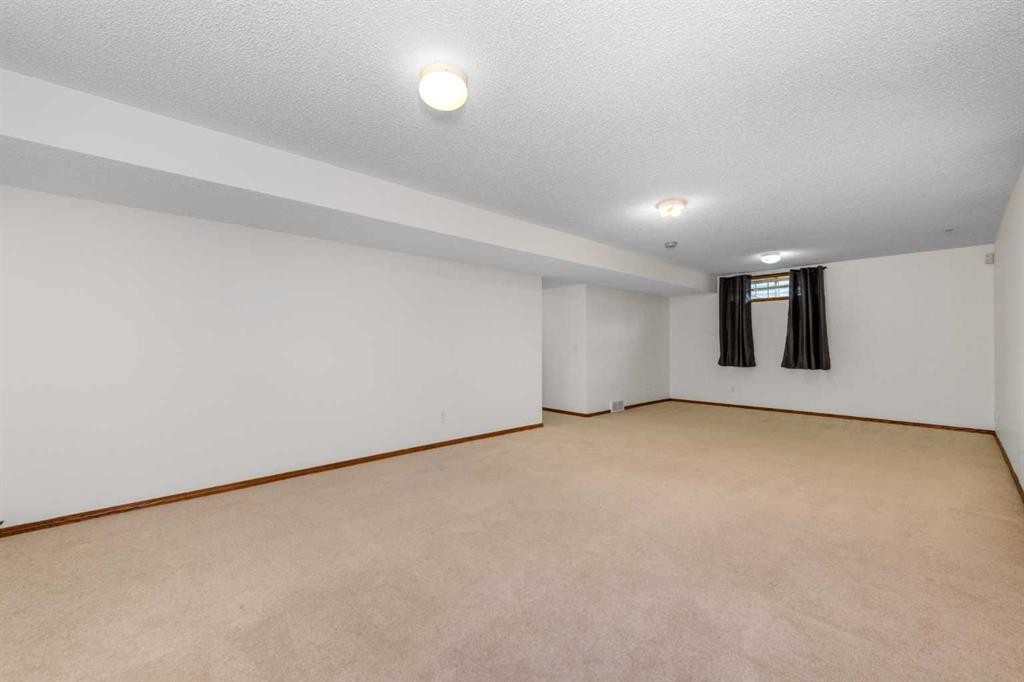 28 Coral Reef Link Ne, Calgary, AB - Indoor Photo Showing Other Room